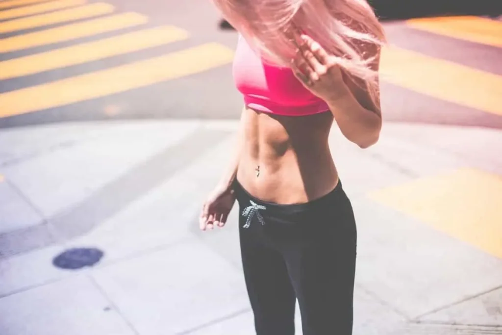 Woman with toned stomach after LA-EMS Body Sculpting Treatment Mansfield